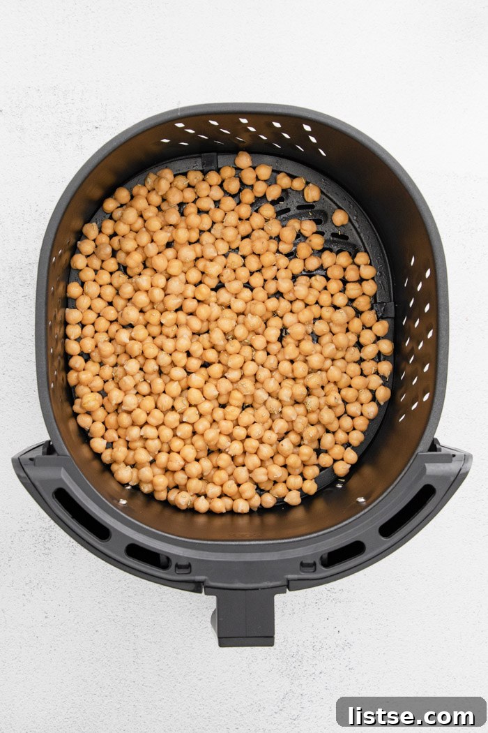 chickpeas in the basket of an air fryer