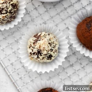 Amaretto Dream Truffles 8 Amaretto Chocolate Truffles, elegantly arranged and coated in nuts, a perfect homemade confection.