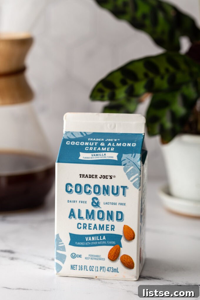 A carton of Trader Joe's Coconut & Almond Vanilla Creamer sits on a clean kitchen counter.