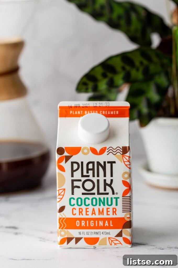A carton of Plant Folk Coconut Creamer Original on a kitchen counter.