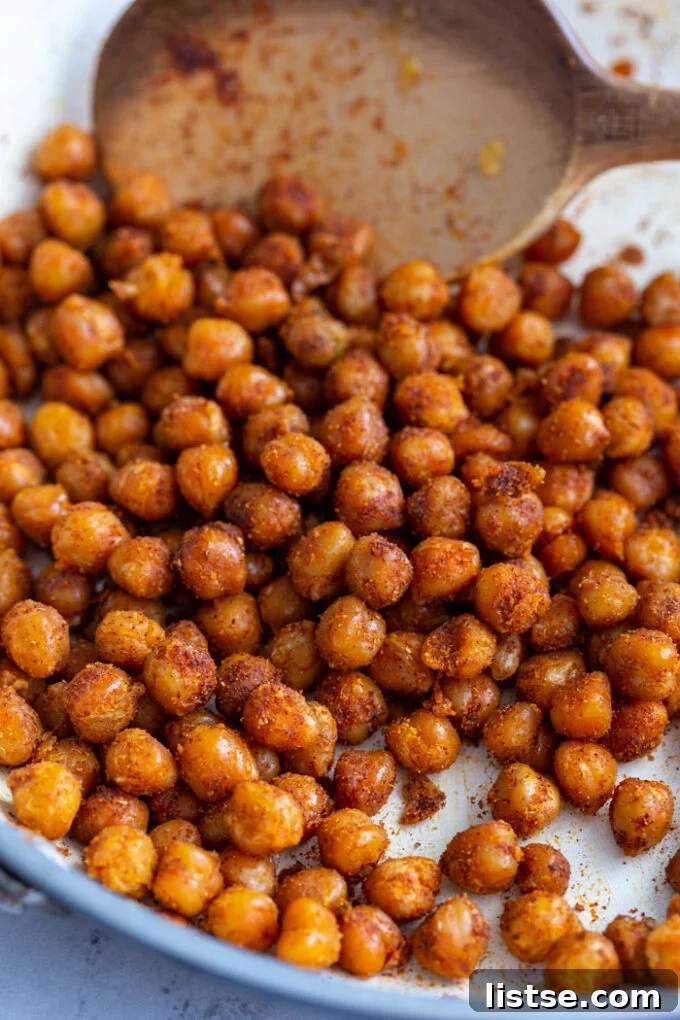 Effortless Vegan Chickpea Gyros 4 spiced crispy chickpeas in a white skillet