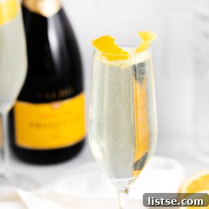 French 75 drink near a bottle of champagne