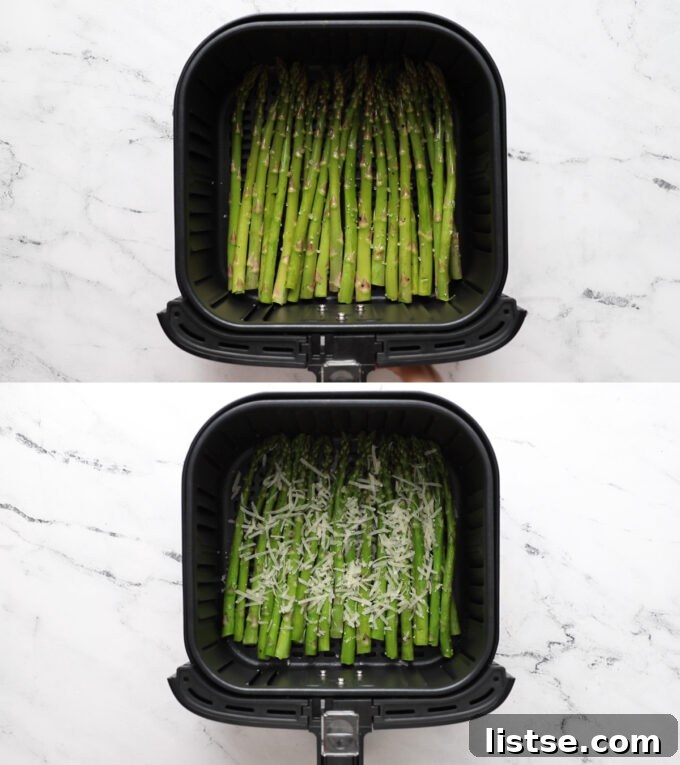 Asparagus cooking in a single layer in the air fryer basket