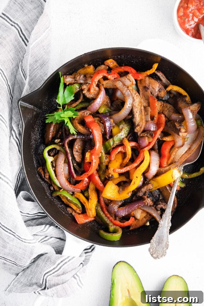 Sizzling Veggie Fajitas 7 vegetables in a skillet cooked for Vegetarian fajitas