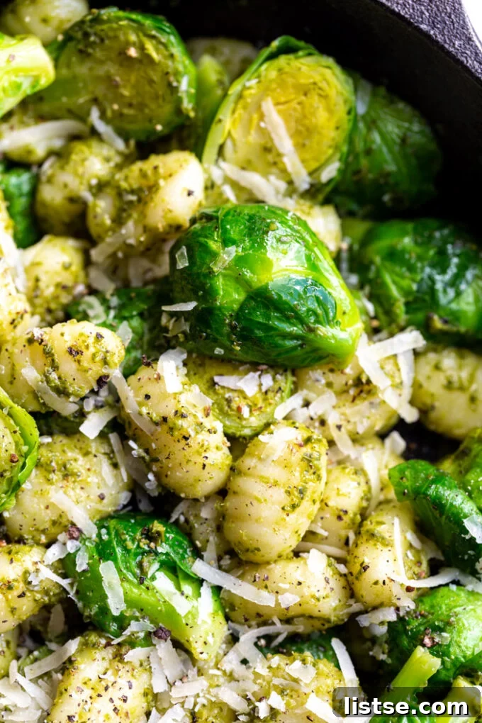 Vibrant Brussels Sprouts Pesto Gnocchi 6 Another enticing view of the Brussels Sprouts Pesto Gnocchi dish in a cast iron skillet, ready to be enjoyed.