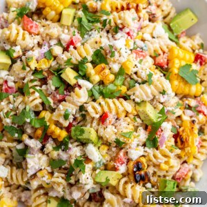 Big bowl of street corn pasta salad made with rotini and lots of fresh veggies