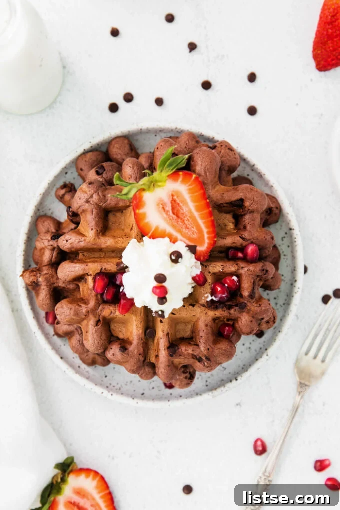 Decadent Chocolate Waffles 4 chocolate waffles topped with whipped cream, chocolate chips and fresh fruit