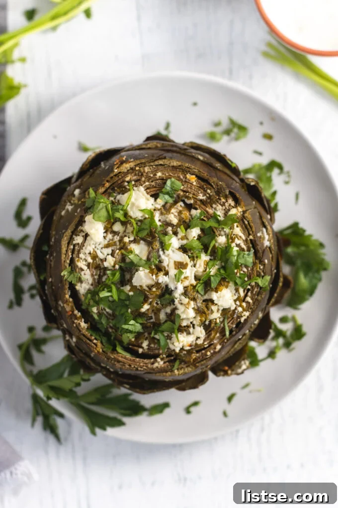 baked artichoke topped with feta and parsley