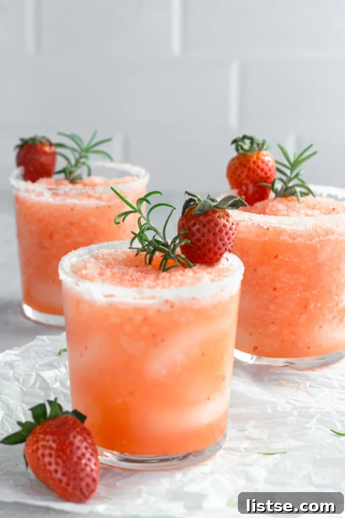 Close-up of a refreshing Frozen Strawberry Salty Dog cocktail in a glass, ready to be enjoyed.