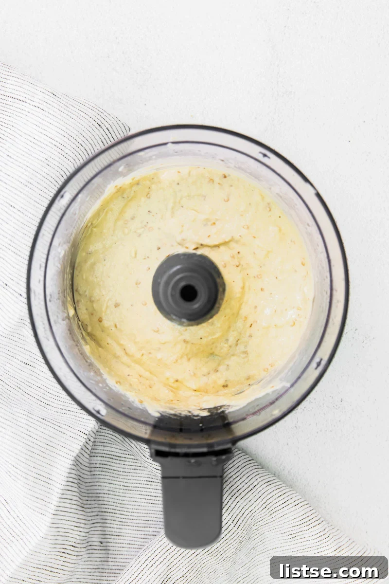 Baba Ganoush ingredients being blended to a smooth consistency in a food processor