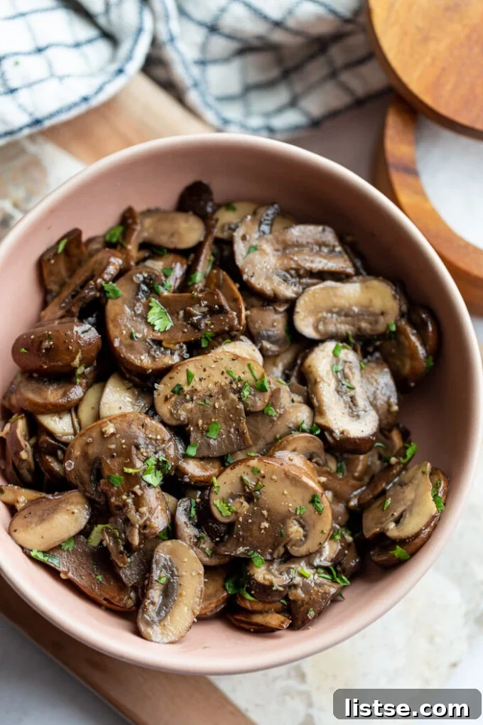 sautéed mushrooms in a pink serving bowl 