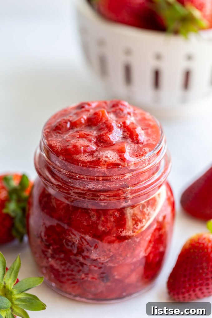 Homemade strawberry compote in a small glass jar