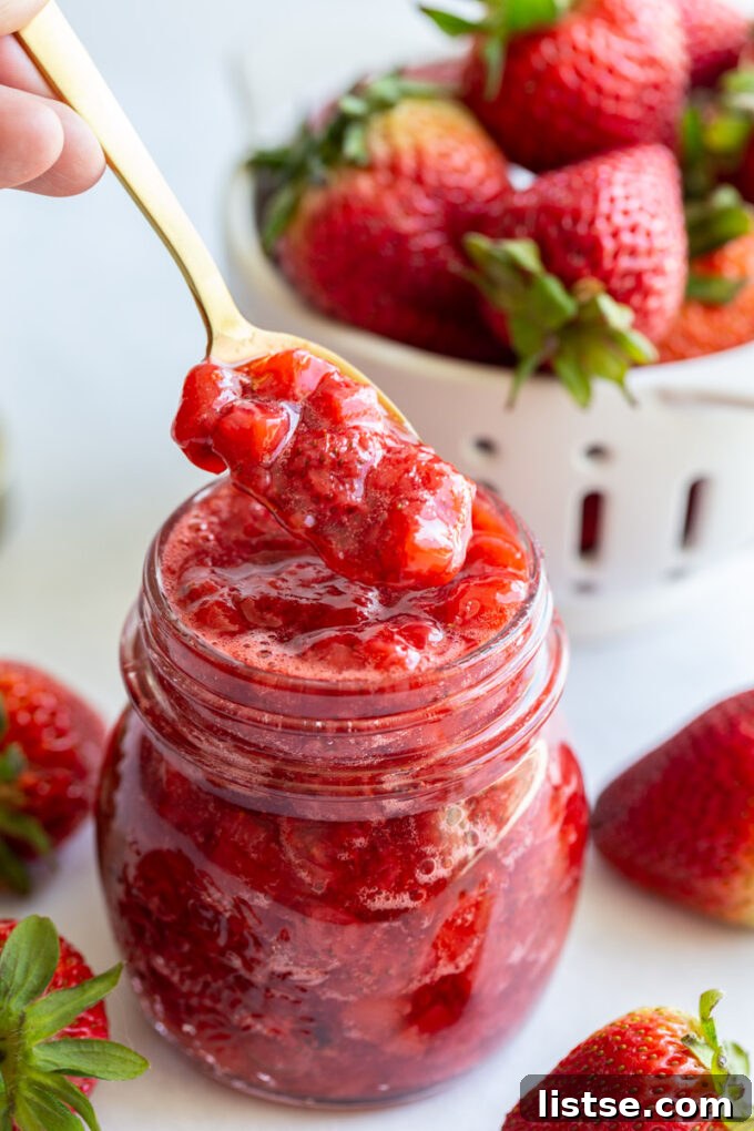 Serving strawberry compote with a spoon