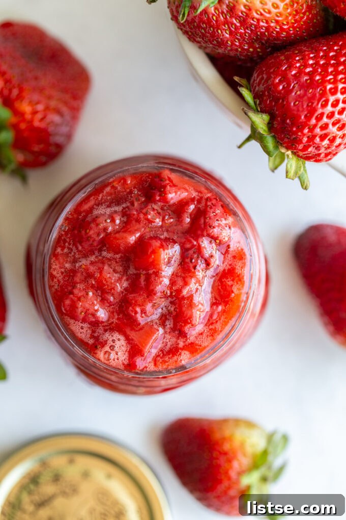 Strawberry sauce in a small glass jar