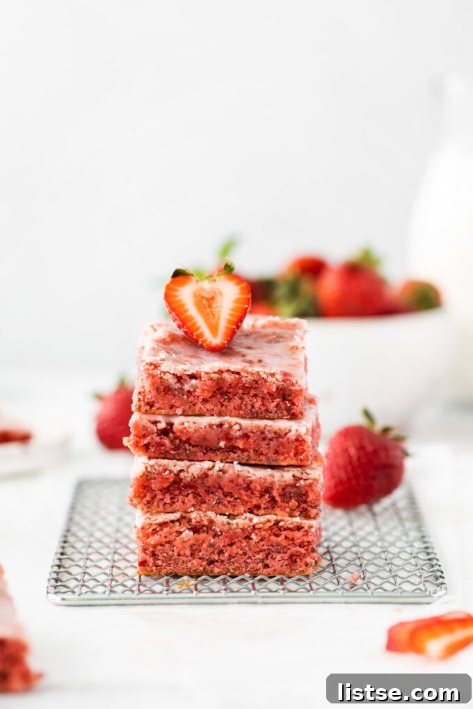 Strawberry Chocolate Bliss 3 Stack of moist and chewy cake mix strawberry brownies, ready to be enjoyed.