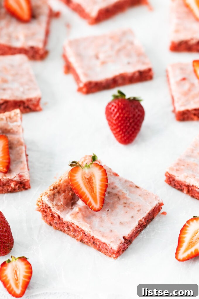 Strawberry Chocolate Bliss 4 Perfectly pink brownies made with a strawberry cake mix, cut into squares.