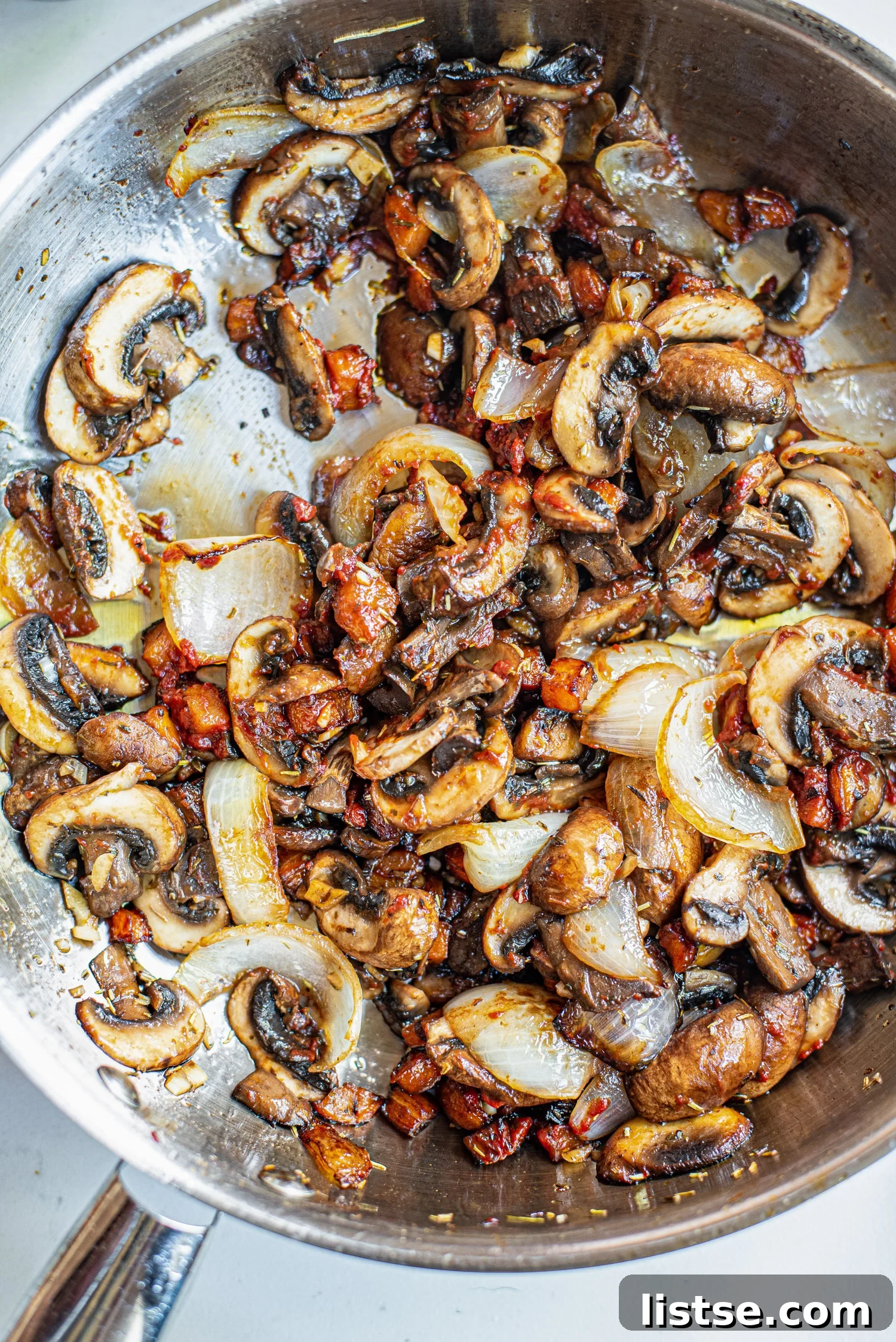 Sautéing onions and mushrooms in a skillet