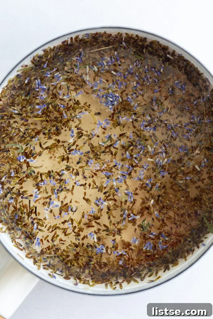 Dried lavender simmering in a pot with water and sugar to create a lavender simple syrup.