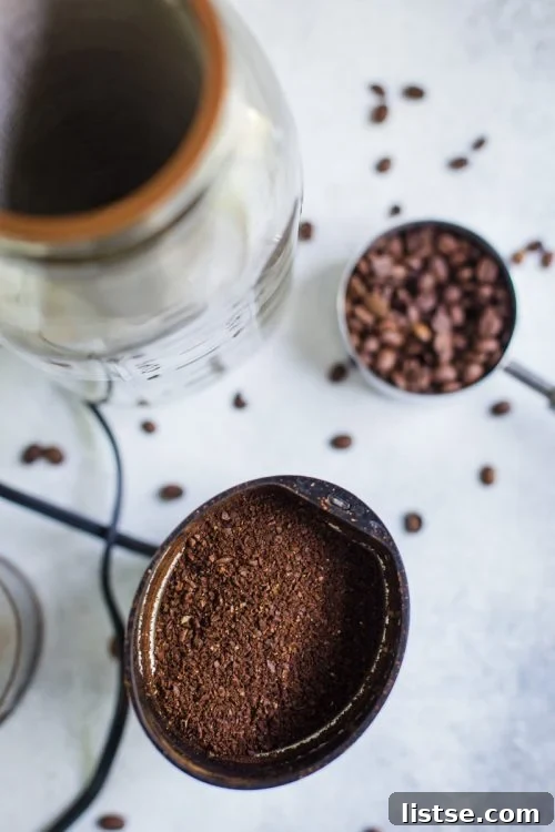 coffee beans being ground up in a coffee grinder