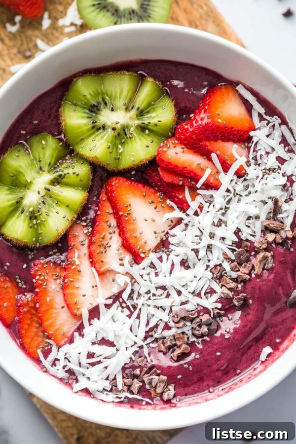 K-Food Wonders 5 A vibrant acai bowl topped with fresh kiwi slices, granola, and other fruits, ready to be enjoyed