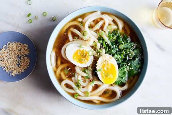 Uncommon U-Starting Culinary Delights 3 A bowl of hot Udon noodles with various toppings, illustrating a common Japanese dish.