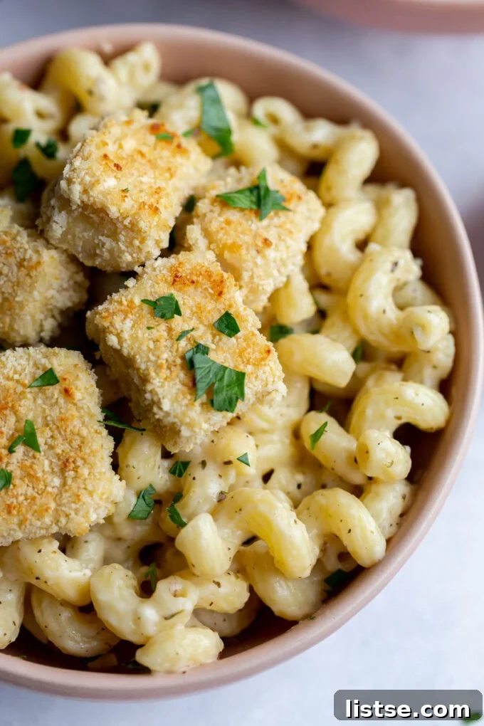 Velvety Cream Sauce Cavatappi 5 Cavatappi Pasta topped with golden croutons, showcasing a delicious meal.