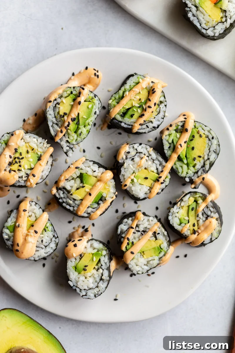 avocado sushi rolls topped with spicy mayo