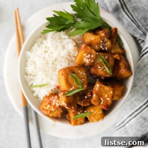 Air Fryer Spicy Tofu served with rice in a small bowl