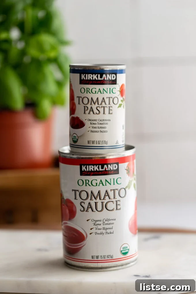 A jar of concentrated tomato paste on top of a jar of ready-made tomato sauce, illustrating the concept of substitution.