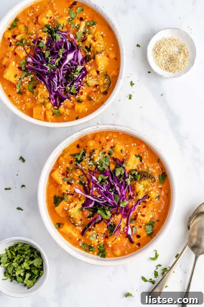Effortless Vegetarian Crockpot Feasts 11 Vibrant quinoa curry served in white bowls, garnished with fresh cilantro.