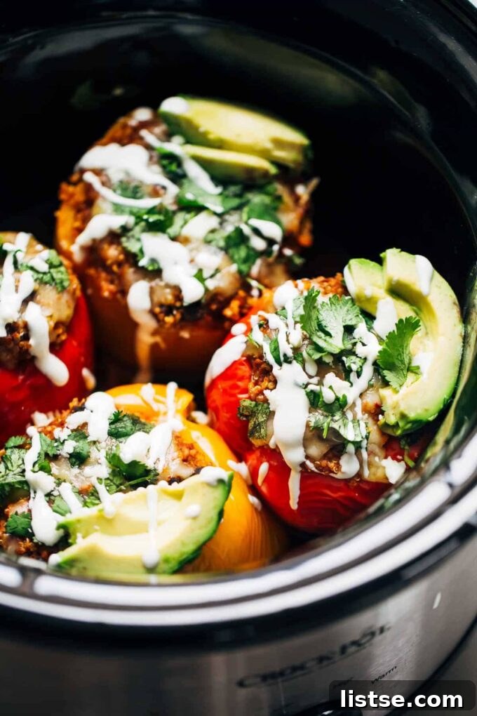 Effortless Vegetarian Crockpot Feasts 12 Flavorful stuffed peppers cooking gently in a slow cooker, ready for a hearty meal.