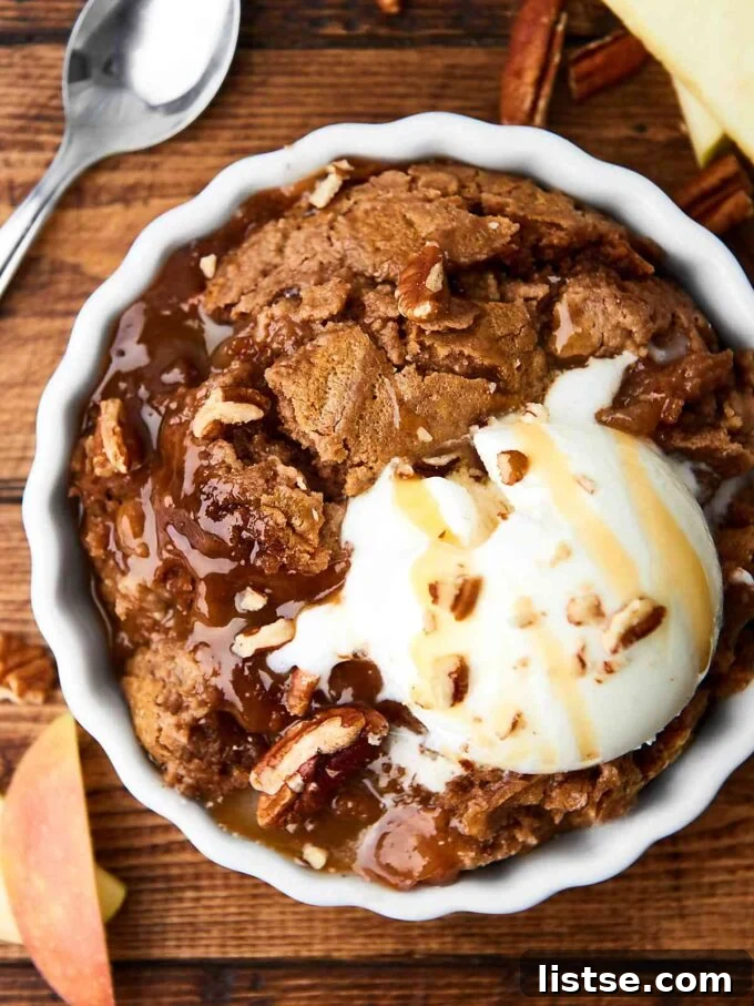 Effortless Vegetarian Crockpot Feasts 10 Decadent caramel apple dump cake, topped with a scoop of vanilla ice cream, served warm.
