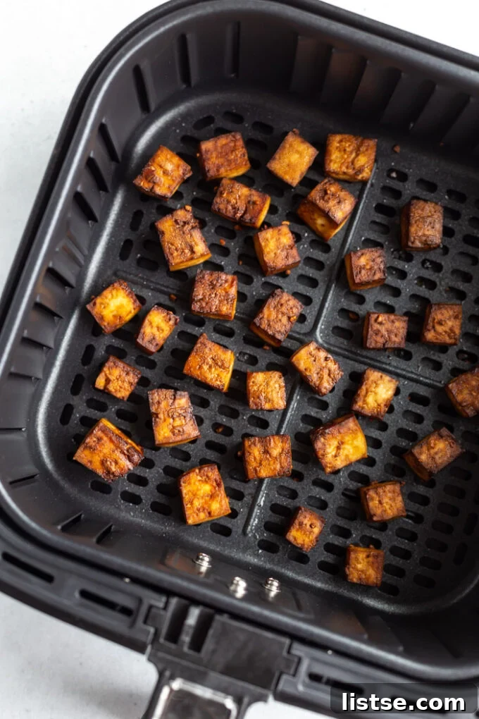 Crispy golden tofu cubes perfectly air-fried, ready to be enjoyed.