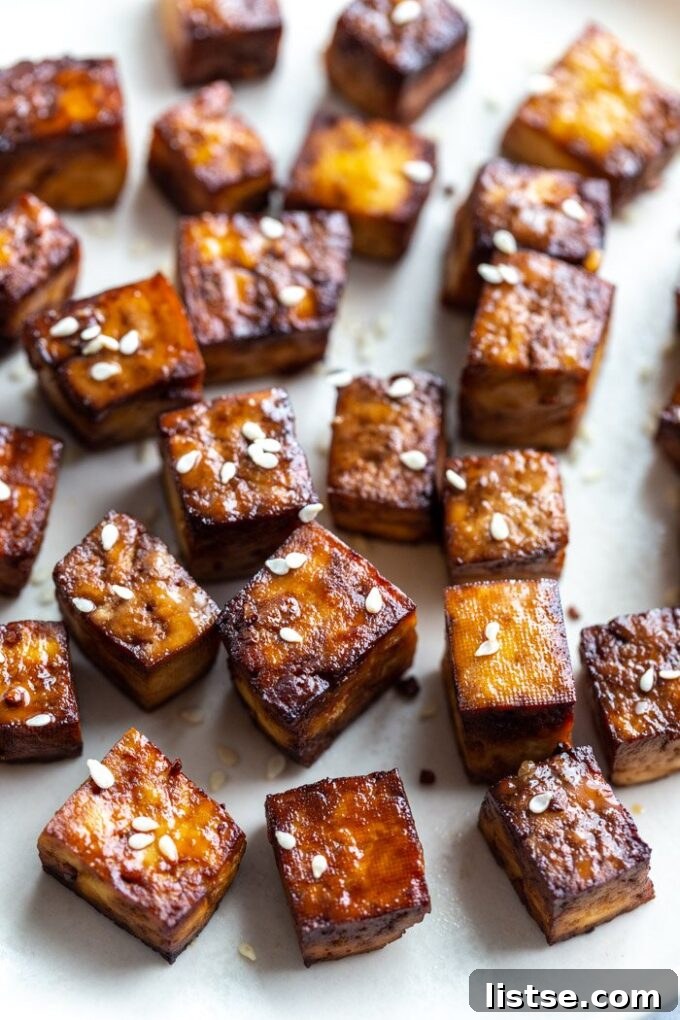 Perfectly air-fried tofu cubes arranged neatly, showcasing their golden and crispy texture.