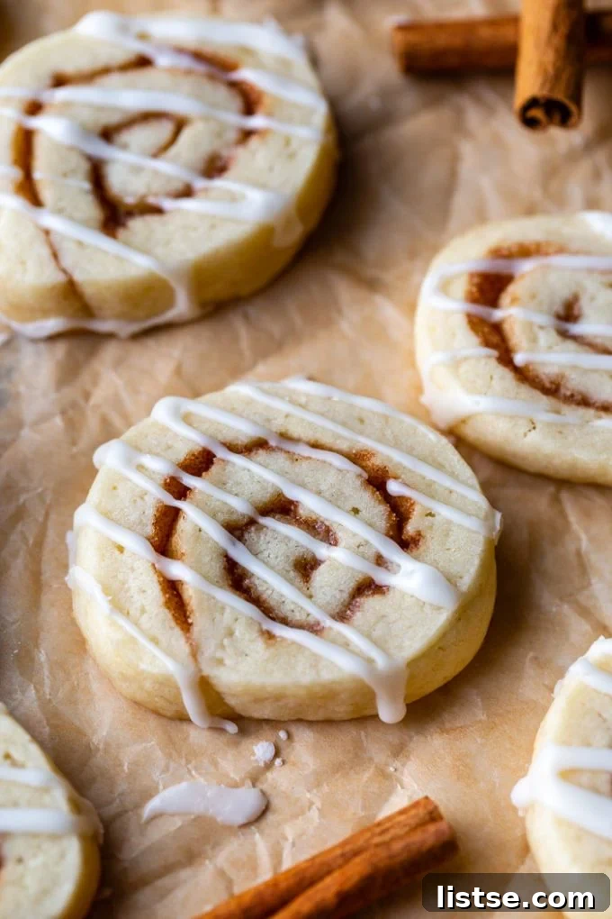 Delicious vegan cinnamon roll cookies beautifully swirled and topped with a sweet glaze.