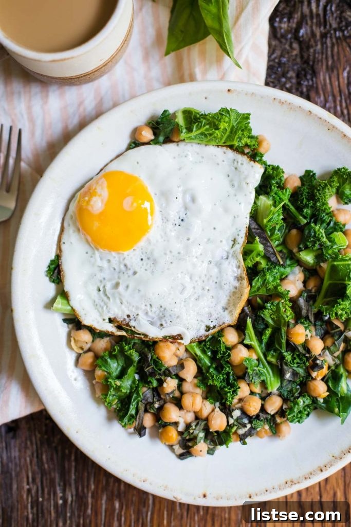 Inspired Chickpea Meals 14 A hearty Chickpea and Kale Breakfast Skillet, brimming with nutritious ingredients, perfect for a filling and healthy start to the day.
