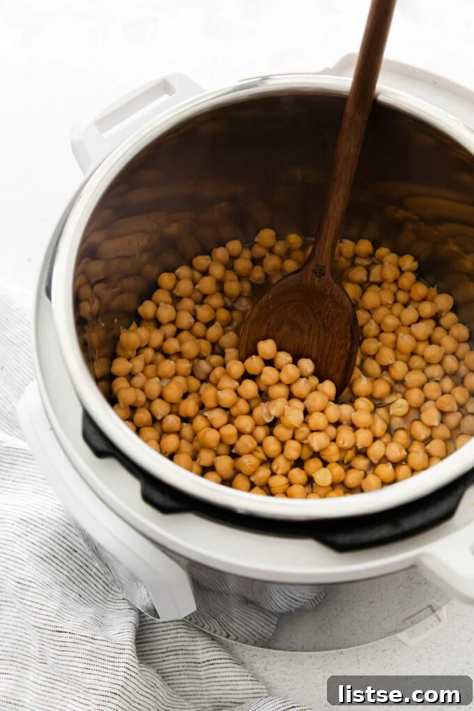 Inspired Chickpea Meals 3 Chickpeas being cooked efficiently in an Instant Pot, showcasing a convenient method for preparing this versatile legume.