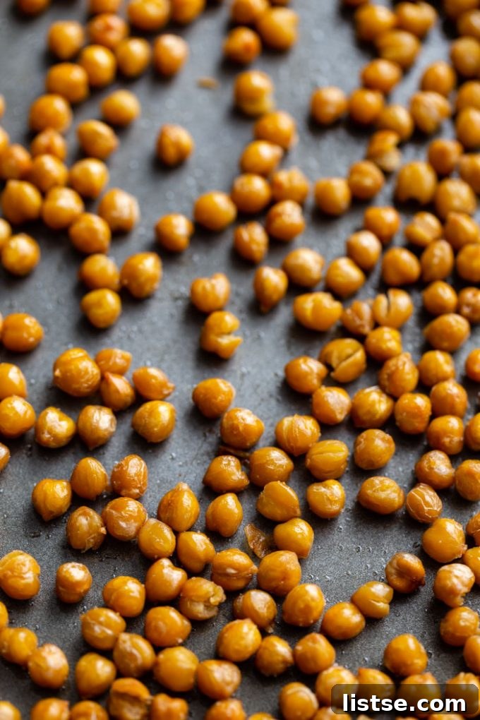 Inspired Chickpea Meals 5 Close-up of golden brown, perfectly crispy chickpeas, illustrating their inviting texture and delicious potential as a snack or topping.