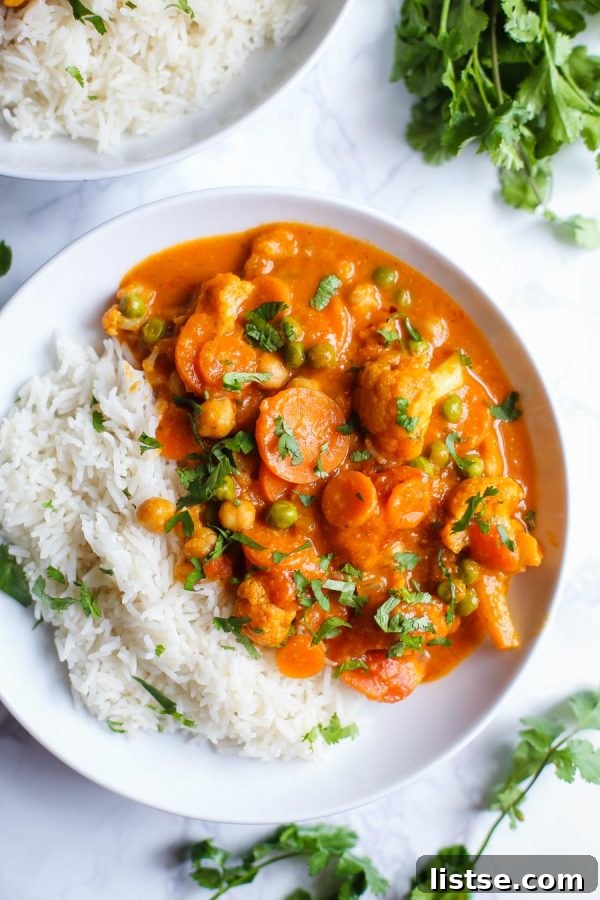 Inspired Chickpea Meals 9 A vibrant bowl of Loaded Veggie Tikka Masala, showcasing a rich, creamy sauce with colorful vegetables and chickpeas, a perfect vegan dinner.