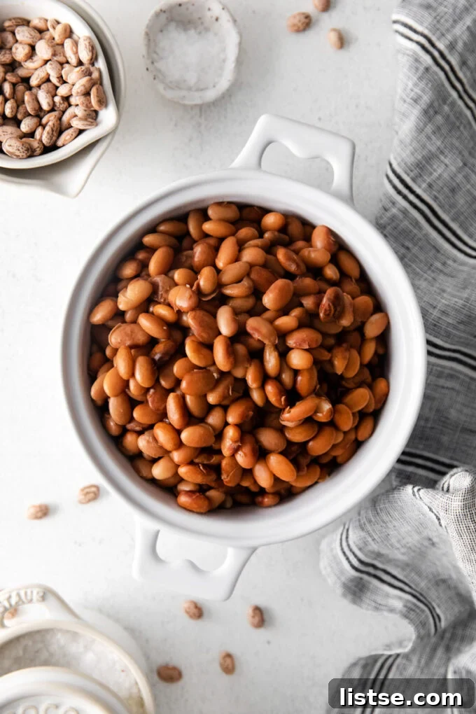 Creamy Instant Pot Pinto Beans 7 Instant Pot Pinto Beans in a white bowl, ready to be served