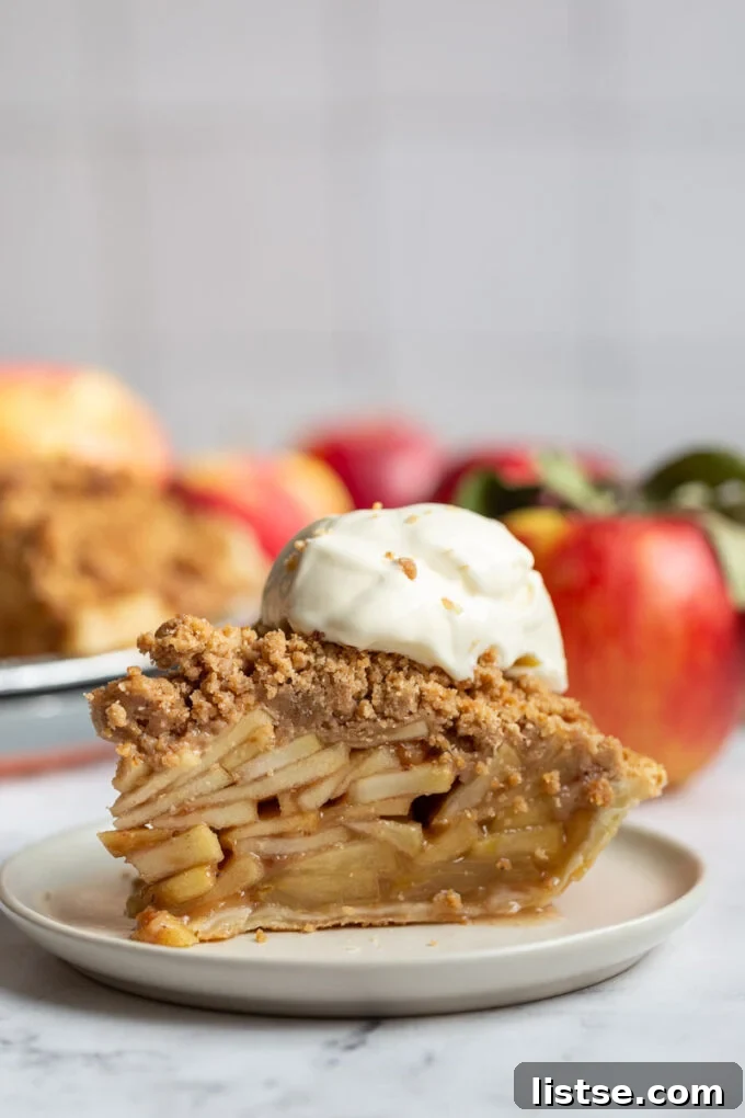 Heartwarming Dutch Apple Pie 2 Slice of Dutch Apple Pie topped with a scoop of vanilla ice cream