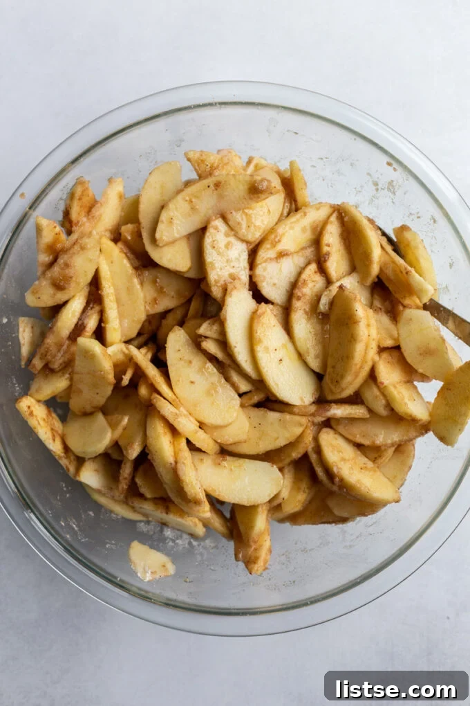 Heartwarming Dutch Apple Pie 4 Tossing apple slices with sugar