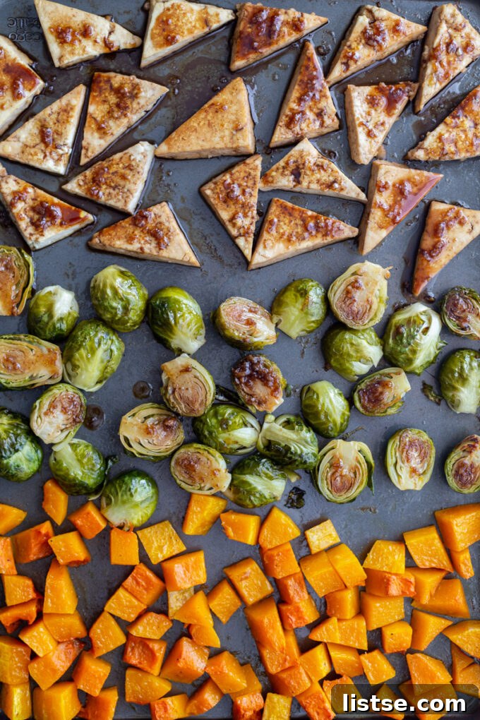 marinated tofu and seasoned veggies on sheet pan