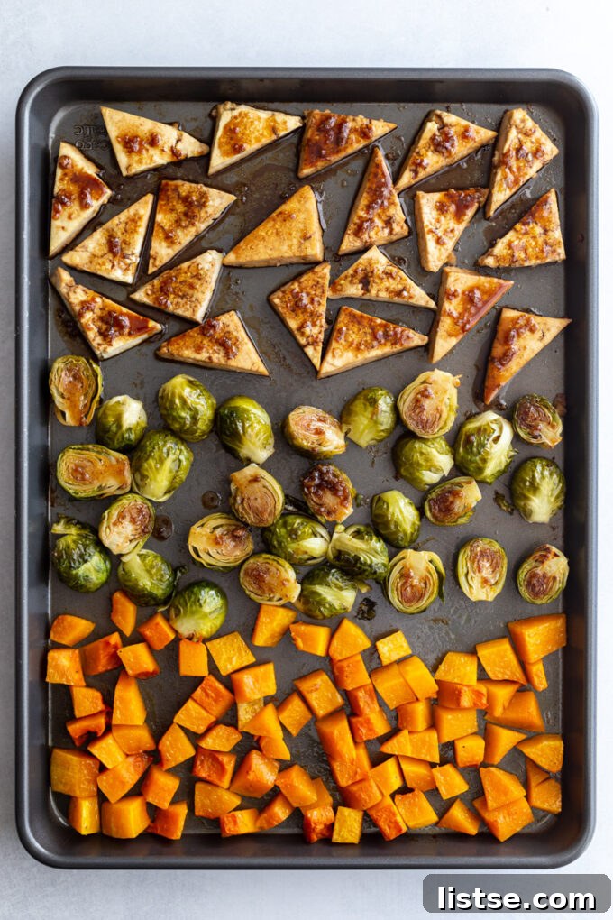 cooked tofu and veggies on a sheet pan