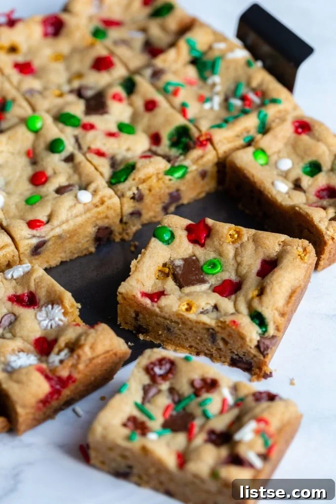 Festive Plant-Based Cookie Delights 7 Square-cut vegan chocolate chip cookie bars with festive red, green, and white sprinkles
