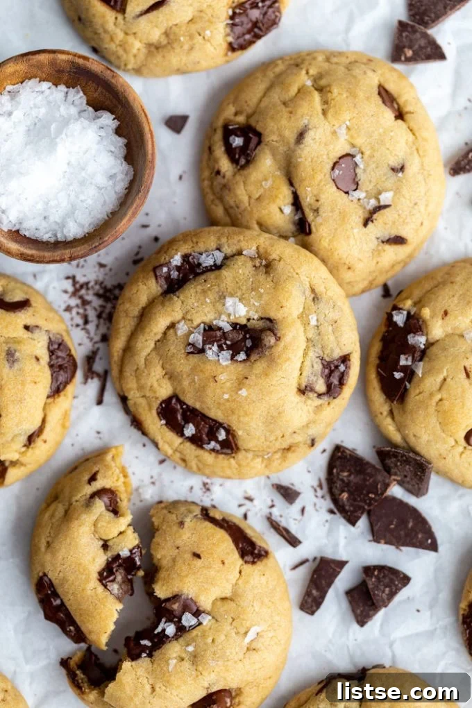 Festive Plant-Based Cookie Delights 10 Several vegan chocolate chip cookies stacked, garnished with a sprinkle of flaky sea salt