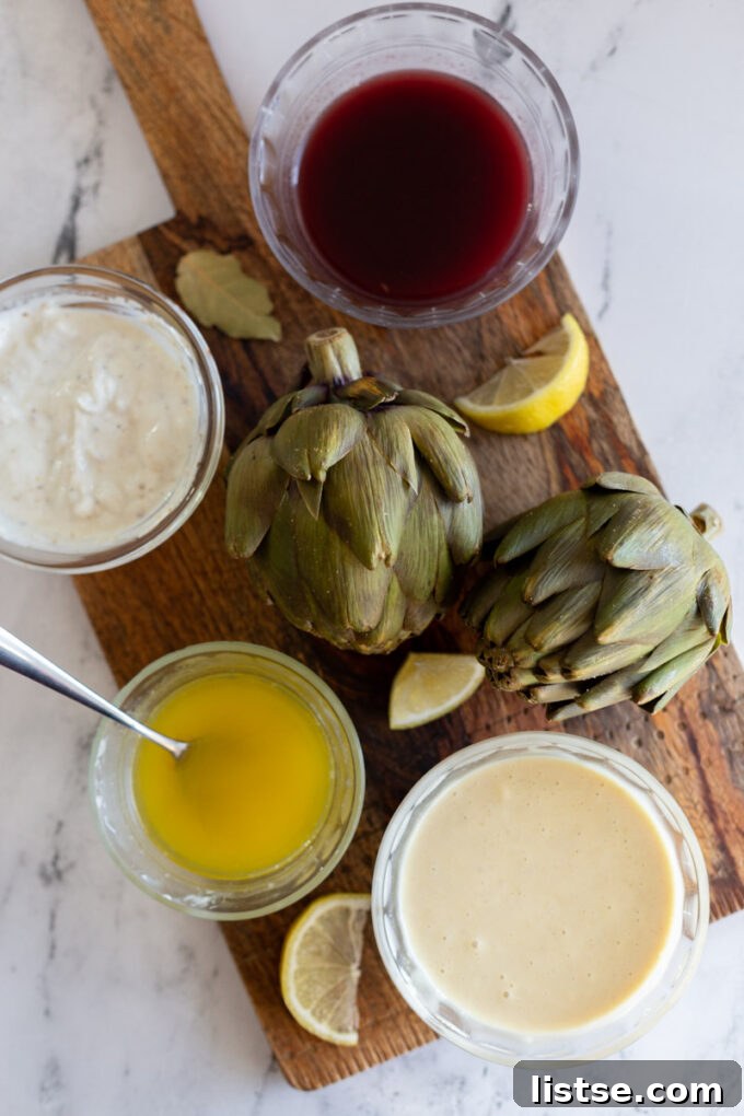 Sensational Artichoke Dips 2 Freshly cooked artichokes with a vibrant dipping sauce ready for enjoyment.