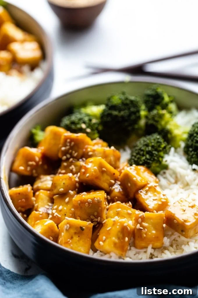 sesame tofu bowls served with broccoli and rice