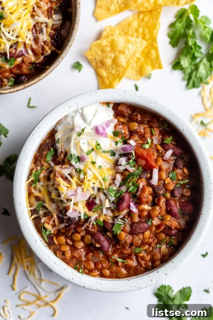 lentil chili topped with sour cream and cheese
