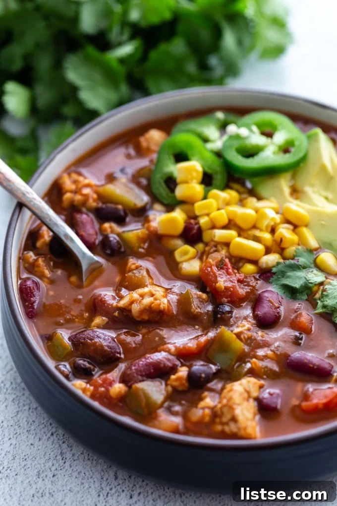 tempeh chili topped with sliced jalapeños 